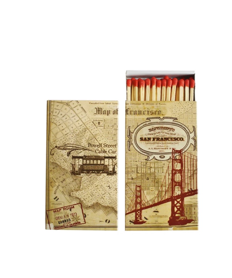 Two tall matchboxes printed with vintage San Francisco maps, a cable car and the Golden Gate Bridge